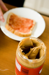 Jar of Peanut Butter with bread with jelly