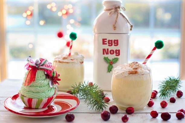 Eggnog with cranberries and Christmas themed decorations