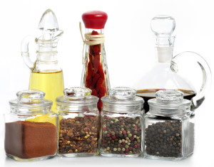 Seasonings, vinegar and oil in glass bottles