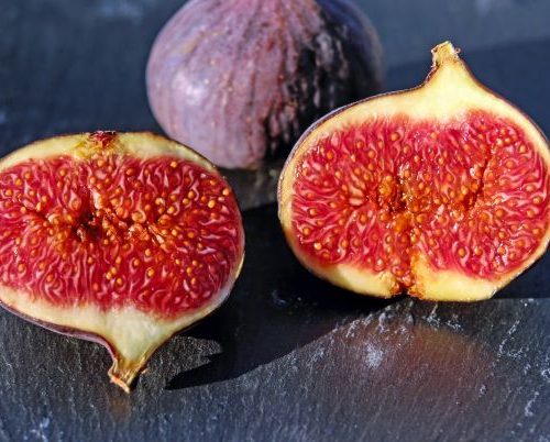 Two Figs, one sliced open