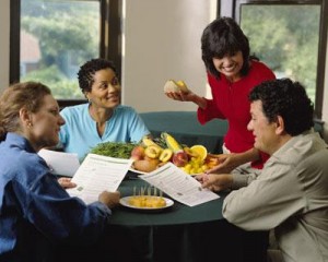 Group reading papers at breakfast