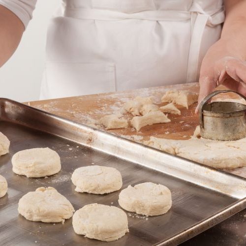 Raw biscuits on sheet pan