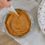 Bowl of PB with plastic knife in it
