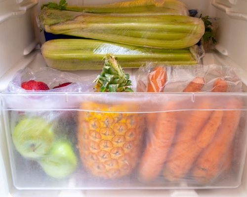 Fresh fruits and vegetables in refrigerator