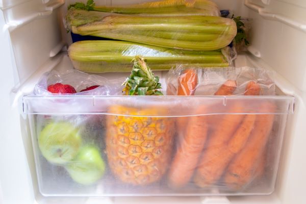 Fresh fruits and vegetables in refrigerator