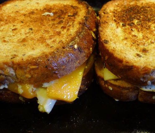 two grilled cheese sandwiches