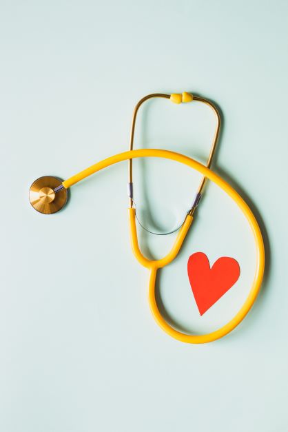 Stethoscope with paper heart in the middle of it