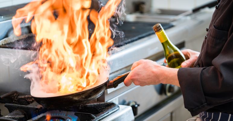 Chef cooking with alcohol