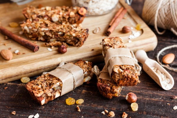 Homemade granola on a cutting board wrapped in paper