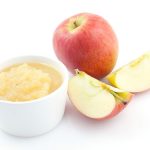 Apples with bowl of applesauce