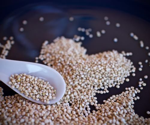 Quinoa cooking in saute pan with oil